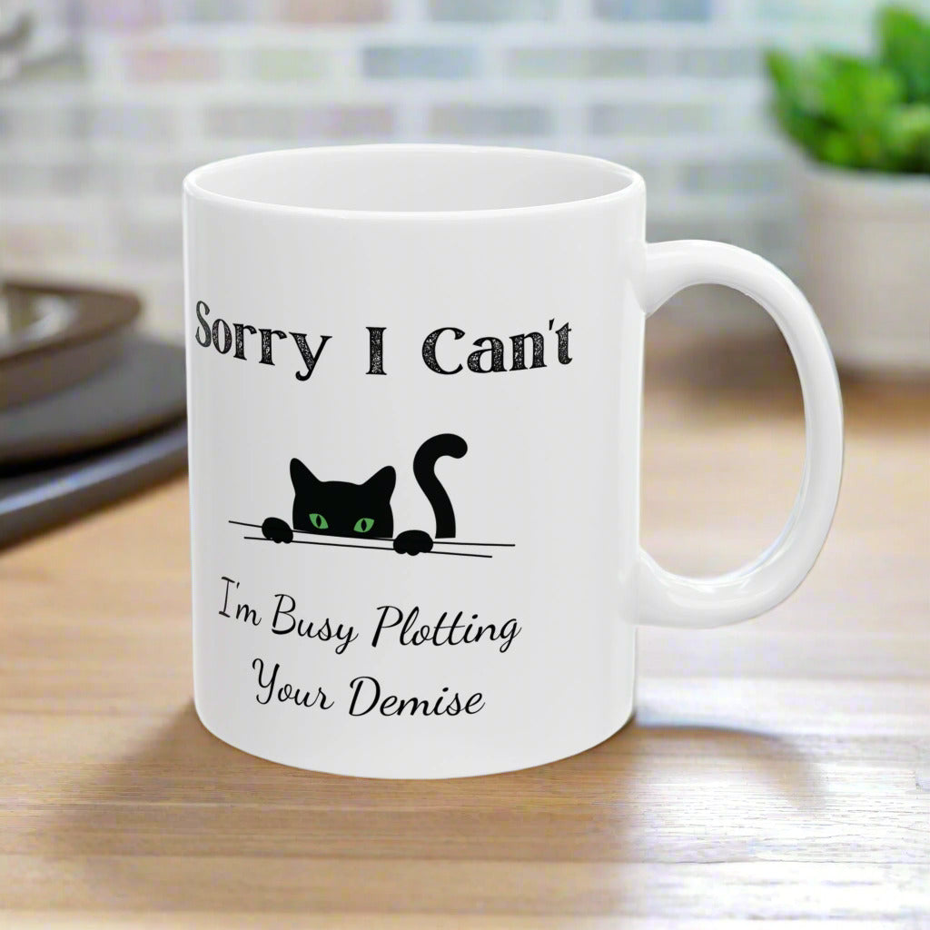 “Sorry I Can’t, I’m Busy Plotting Your Demise” Funny Black Cat Mug – Perfect Gift for Cat Lovers